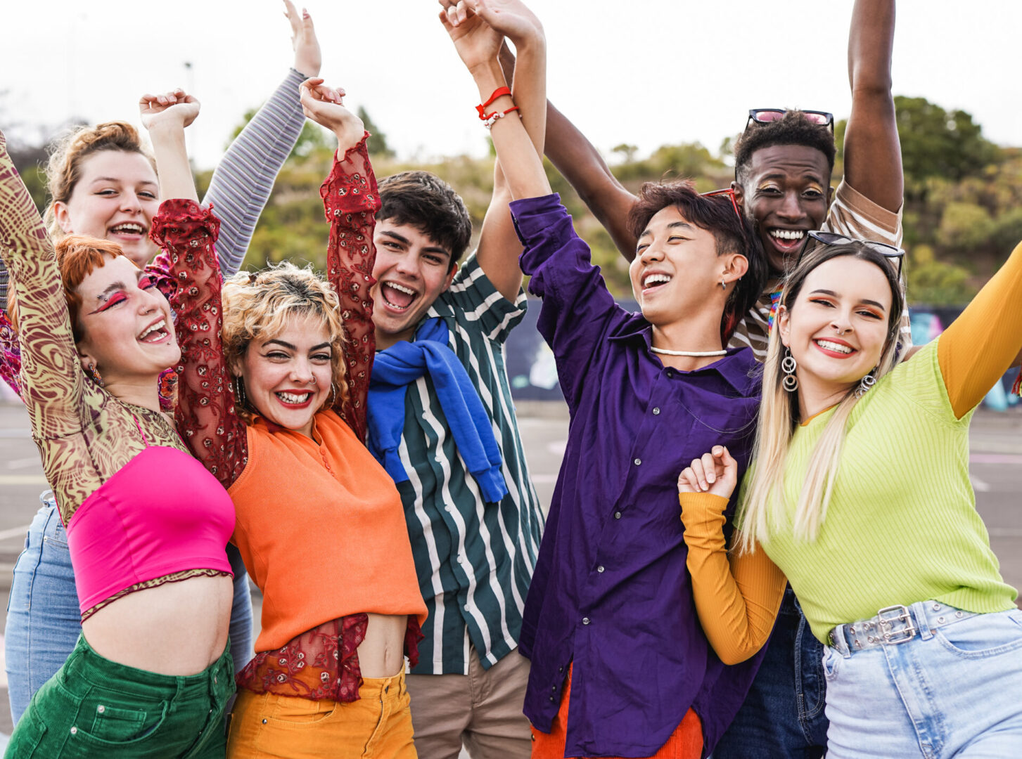 Group of diverse friends holding hands in the air while celebrate success Calm Kids: Anxiety Skills Center