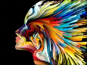 A colorful painting of a woman 's face.