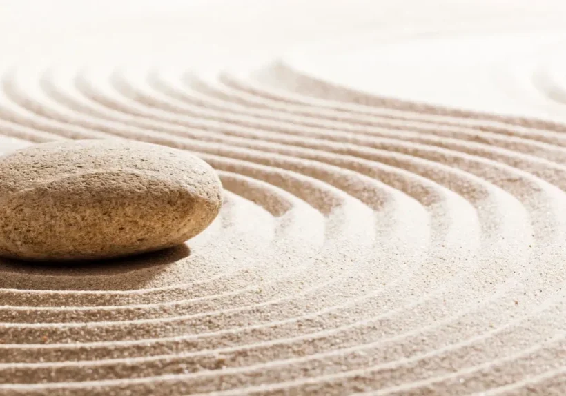 rs=w_1280 (10) A rock sitting on top of sand in the middle of a circle.